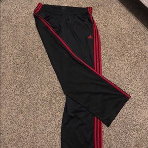 red striped adidas track pants